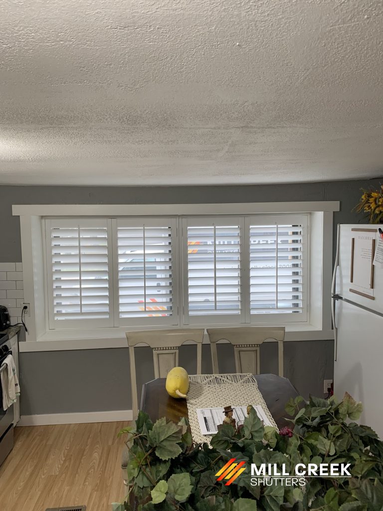 plantation shutters installed in a living room of a home in Salt Lake, UT